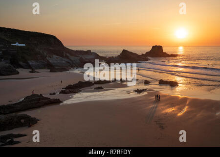 Atlantic sea waves breaking on the beach and rocks at sunset, Zambujeira do Mar, Alentejo region, Portugal, Europe Stock Photo