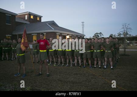 U.S. Marines with 2d Combat Engineer Battalion (CEB), 2nd Marine Division (2d MARDIV), stand in formation on Camp Lejeune, N.C., April 1, 2017.  The Marines participate in a ceremony for the 2nd annual 50 mile run in remembrance of 29 fallen Marines. Stock Photo