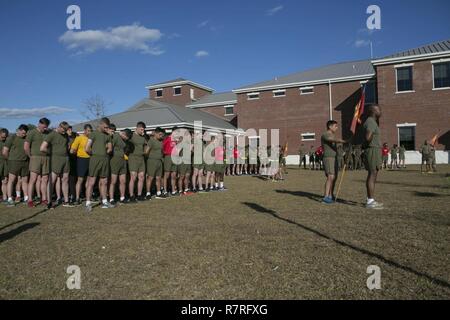 U.S. Marines with Combat Engineer Battalion (CEB), 2nd Marine Division (2d MARDIV), bow their heads during a ceremony on Camp Lejeune, N.C., April 1, 2017.  The Marines participate in a ceremony for the 2nd annual 50 mile run in remembrance of the 29 fallen Marines. Stock Photo