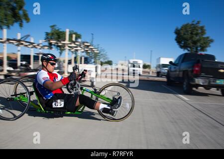 U.S. Army veteran, Jarred Vaina, hand-cycles for the cycling trial for the Warrior Care and Transition's Army Trials at Fort Bliss Texas, April 02, 2017. About 80 wounded, ill and injured active-duty Soldiers and veterans are competing in eight different sports 2-6 April for the opportunity to represent Team Army at the 2017 Department of Defense Warrior Games. Stock Photo