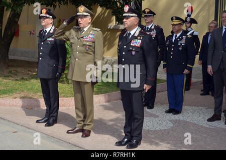 Gen. Tullio Del Sette, Italian Carabinieri General Commander (left), Gen. Claudio Graziano, Italian Army Chief of Staff (center) and Brig. Gen. Giovanni Pietro Barbano, Center of Excellence for Stability Police Units (CoESPU) director (left), receive salute of honor at the end of visit at Center of Excellence for Stability Police Units (CoESPU) Vicenza, Italy, April 1, 2017.