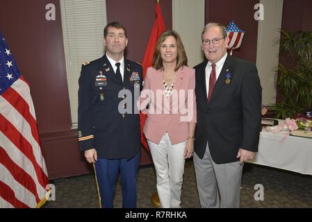 Lt. Col. Stephen Murphy, U.S. Army Corps of Engineers Nashville District commander, thanks Cady Wilson for supporting her husband Mike Wilson, Nashville District deputy district engineer for Project Management, during his retirement ceremony at the district headquarters in Nashville, Tenn., March 31, 2017. (USACE Stock Photo