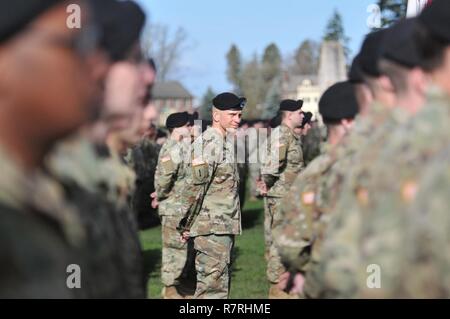 Command Sgt. Maj.  Michael A. Grinston, the Command Sgt. Maj. of I Corps, stands among his soldiers during the Change of Command Ceremony held on Watkins Field, April, 3 on Joint Base Lewis-McChord, Washington. The ceremony was held to display the passing of I Corps command from Lt. Gen. Stephen R. Lanza, the outgoing commanding general, to Lt. Gen. Gary J. Volesky, the incoming commanding general. Stock Photo