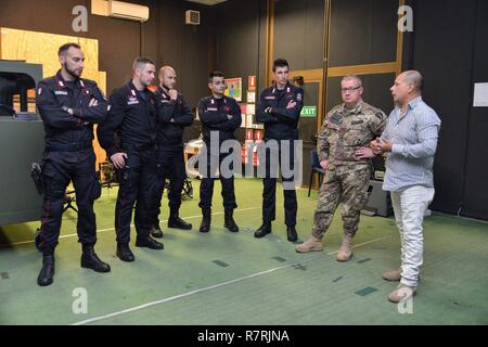 Joseph Gallegos, Training Specialist, Training Support Center Italy, shows the Engagement Skills Trainer (EST) to the Italian Carabinieri of the 13th Regiment Carabinieri “ Friuli Venezia Giulia” Gorizia, during the training at Caserma Ederle, April 3, 2017, Vicenza, Italy. Carabinieri use U.S. Army RTSD South equipment to enhance bilateral relations and to expand levels of cooperation and the capacity of the personnel involved in joint operations.