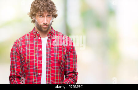 Handsome hispanic model man over isolated background making fish face with lips, crazy and comical gesture. Funny expression. Stock Photo