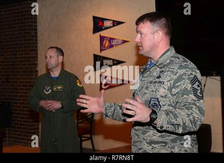 Col. Gentry Boswell, 28th Bomb Wing commander, and Chief Master Sgt. Adam Vizi, 28th Bomb Wing command chief, speak on the importance of the Air Force Assistance Fund inside the Dakota’s Cub at Ellsworth Air Force Base, S.D., March 31, 2017. If interested in donating contact a unit AFAF representative. Stock Photo