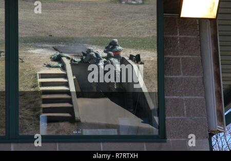 U.S. Army Reserve Spc. Phillip Rogers, 325th Psychological Operations Company (Airborne), U.S. Army Civil Affairs and Psychological Operations Command, completes ground qualification as reflected from the tower window in preparation for mounted gunnery during Operation Cold Steel at Fort McCoy, Wis., April 6, 2017. Operation Cold Steel is the U.S. Army Reserve's crew-served weapons qualification and validation exercise to ensure that America's Army Reserve units and Soldiers are trained and ready to deploy on short-notice and bring combat-ready and lethal firepower in support of the Army and o Stock Photo