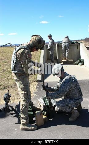 U.S. Army Reserve Soldiers with 325th Psychological Operations Company (Airborne), U.S. Army Civil Affairs and Psychological Operations Command, prepare ammunition for ground qualification during Operation Cold Steel at Fort McCoy, Wis., April 6, 2017. Operation Cold Steel is the U.S. Army Reserve's crew-served weapons qualification and validation exercise to ensure that America's Army Reserve units and Soldiers are trained and ready to deploy on short-notice and bring combat-ready and lethal firepower in support of the Army and our joint partners anywhere in the world. Stock Photo