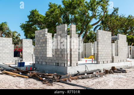 Key West, USA - May 1, 2018: cement concrete construction of house on street in Florida city island on travel, sunny day, residential neighborhood rea Stock Photo
