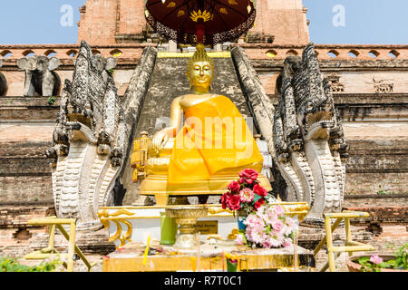 Gilded Buddha statue at Wat Chedi Luang, Chiang Mai, Thailand Stock Photo