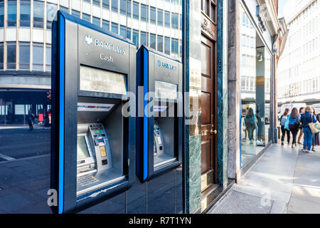 London, UK - September 13, 2018: Blue Barclays bank cash sign atm, banking branch, office building entrance in Chelsea, sidewalk Stock Photo