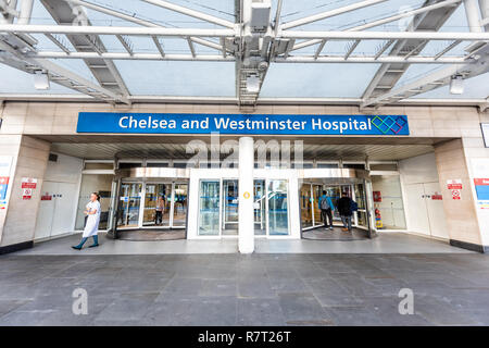London, UK - September 13, 2018: Neighborhood district of Chelsea, street, modern architecture, sign for Westminster hospital entrance doors, people Stock Photo