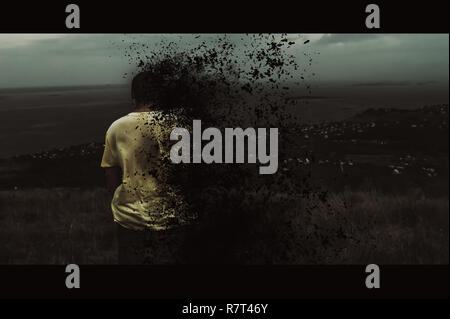 A young man is burning against the background of a global catastrophe. Cinema style Stock Photo