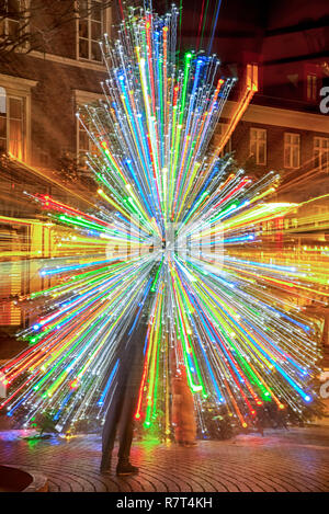 A zoom effect on a christmas tree whilst taken a long exposure photo. Stock Photo