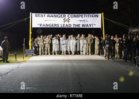 U.S. Army Rangers begin the 34th annual David E. Grange Jr. Best Ranger Competition at Ft. Benning, Ga., Apr. 7, 2017. The Best Ranger competition is a three-day event consisting of challenges to test competitor's physical, mental, and technical capabilities, and places the military's best two-man Ranger teams against each other to compete for the title of Best Ranger. Stock Photo