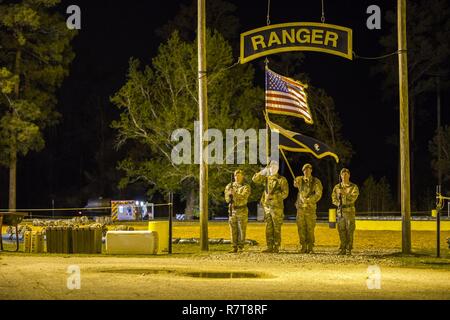 U.S. Army Rangers begin the 34th annual David E. Grange Jr. Best Ranger Competition at Ft. Benning, Ga., Apr. 7, 2017. The Best Ranger competition is a three-day event consisting of challenges to test competitor's physical, mental, and technical capabilities, and places the military's best two-man Ranger teams against each other to compete for the title of Best Ranger. Stock Photo