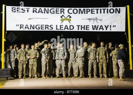 U.S. Army Rangers begin the 34th annual David E. Grange Jr. Best Ranger Competition at Ft. Benning, Ga., Apr. 7, 2017. The Best Ranger competition is a three-day event consisting of challenges to test competitor's physical, mental, and technical capabilities, and places the military's best two-man Ranger teams against each other to compete for the title of Best Ranger. Stock Photo