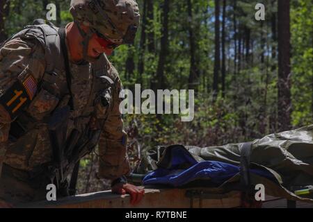 A U.S. Army Ranger climbs a wall on the Ranger First Responder Course ...