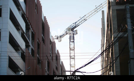 Industry construction site. Working tower crane. Industrial Stock Photo