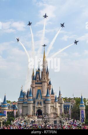 ORLANDO, Fla. (April 6, 2017) U.S. Navy Flight Demonstration Squadron, The Blue Angels perform the Delta Breakout over Cinderella's Castle at Walt Disney World's Magic Kingdom en route to the Sun n' Fun Air Show in Lakeland, Florida. The Blue Angels are scheduled to perform more than 60 demonstrations across the U.S. in 2017. Stock Photo