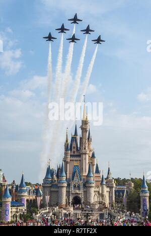 Orlando, Fla. (April 6, 2017) U.S. Navy Flight Demonstration Squadron, The Blue Angels fly over Cinderella's Castle at Walt Disney World's Magic Kingdom en route to the Sun n' Fun Air Show in Lakeland, Florida. The Blue Angels are scheduled to perform more than 60 demonstrations across the U.S. in 2017. Stock Photo