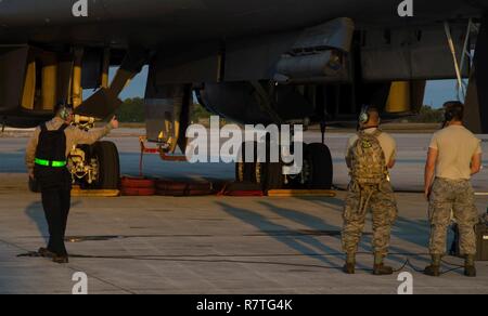 Ground crew from an integrated unit of reservists and active duty Airmen gives a thumbs up prior to a B-1 Lancer flight at Boca Chica Naval Air Station, Key West Fla., March 23, 2017. Airmen from the 489th Bombardment Group and the 7th Bomb Wing assisted the Joint Interagency Task Force South in countering smugglers in the East Pacific and West Caribbean Ocean. Stock Photo