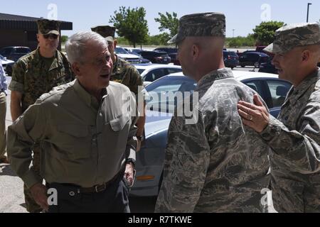 U.S. Marine Corps Lt. Col. (Retired) Oliver North, speaks to U.S. Air Force Lt. Col. Matthew Welling, 312th Training Squadron Commander, at the Fire Academy on Goodfellow Air Force Base, Texas, April 5, 2017. North toured the academy to see how Air Force firefighters are trained. Stock Photo