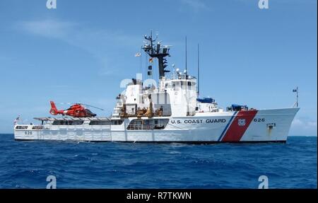 The Coast Guard Cutter Dependable underway in the Eastern Pacific Ocean on patrol. The Cutter Dependable's crew returned to their homeport, Virginia Beach, Virginia, after a two-month patrol of the Eastern Pacific Ocean May 4, 2017. During this patrol, the crew seized over 8,000 pounds of cocaine with an estimated value of $122 million which will be used as evidence to prosecute 19 suspected smugglers. Stock Photo