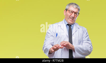 Handsome senior doctor, scientist professional man wearing white coat over isolated background disgusted expression, displeased and fearful doing disg Stock Photo