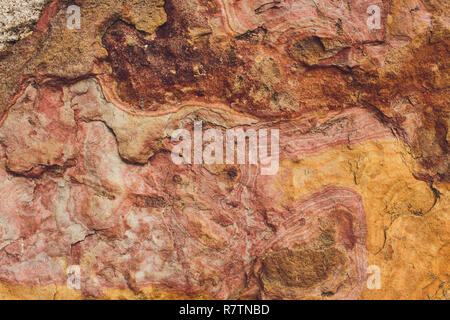 Rock layers - a colorful formations of rocks stacked over the hundreds years. Interesting background with fascinating texture. Stock Photo