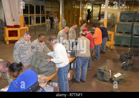 507th Air Refueling Wing Citizen Airmen process through the personnel deployment function line March 25, 2017, Tinker Air Force Base, Okla. Stock Photo