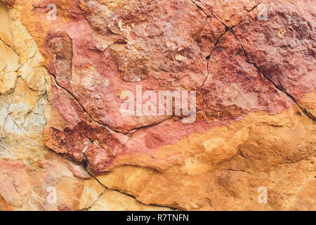 Rock layers - a colorful formations of rocks stacked over the hundreds years. Interesting background with fascinating texture. Stock Photo