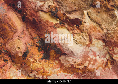 Rock layers - a colorful formations of rocks stacked over the hundreds years. Interesting background with fascinating texture. Stock Photo