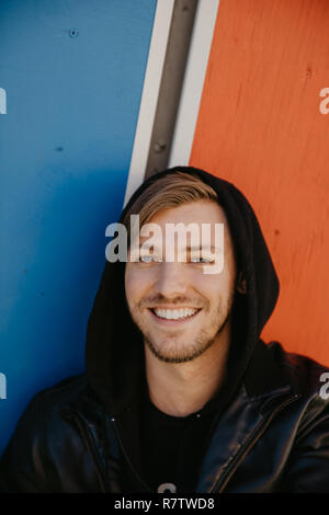 Handsome Attractive Male Adult Person Model in Winter Autumn Season Head shots Face Up Close Expression Portraits with Vivid Color Painted Background Stock Photo