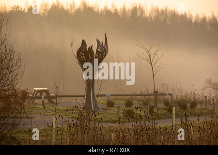 Mining Memorial Flame on a misty morning at Gedling Country Park in Nottingham, Nottinghamshire England UK Stock Photo