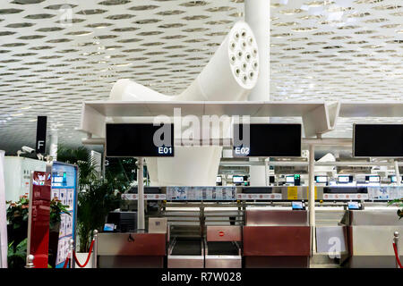 Airport Two Empty Check In Counters with Billboards Ventilation System at Departure Hall Stock Photo