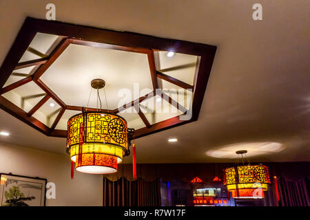 Traditional Chinese Letters Ornaments Lantern Lamps with Lights on Ceiling. Translation: "Luck" Stock Photo