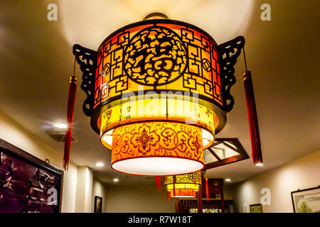 Traditional Chinese Letters Ornaments Lantern Lamps with Lights on Ceiling. Translation: "Luck" Stock Photo