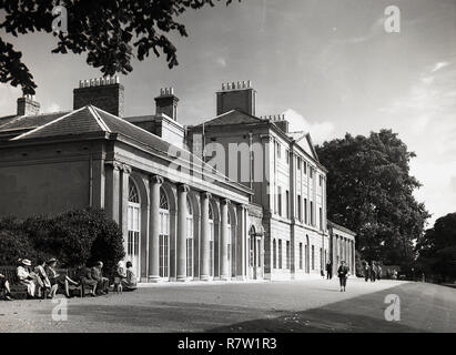1950s, London, exterior view of Kenwood House in Hampstead Heath, a stately home that served as a residence for the earls of Mansfield and was then owned by the Guinness family. Lord Iveagh left the house to the nation and it opened to the public in 1928. Stock Photo