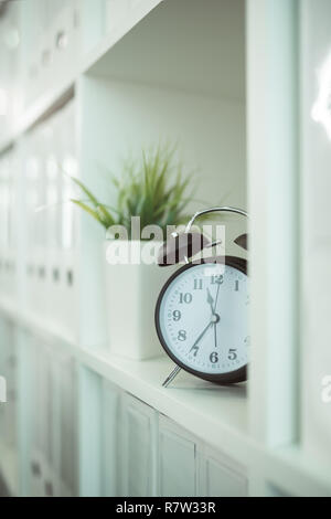 Clock in the medical office, it's time for your next exam appointment at the doctor's. Stock Photo