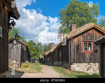 Tourists at the Luostarinmäki Handicrafts Museum, an area of 200 year old wooden buildings which survived the fire of 1827, Turku, Finland Stock Photo