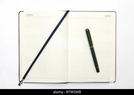 Notebook and pencil on white background. Abstract background for painting, drawing and sketching. Stock Photo