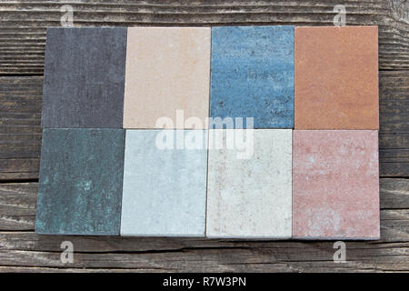 Tile samples on wooden background Stock Photo