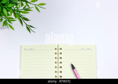 concept of recording your daily affairs. Notepad on a white background. Copy space layout Stock Photo