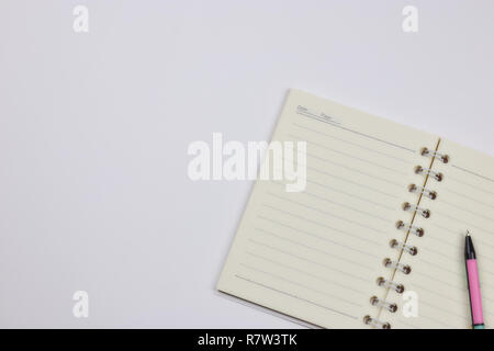 concept of recording your daily affairs. Notepad on a white background. Copy space layout Stock Photo