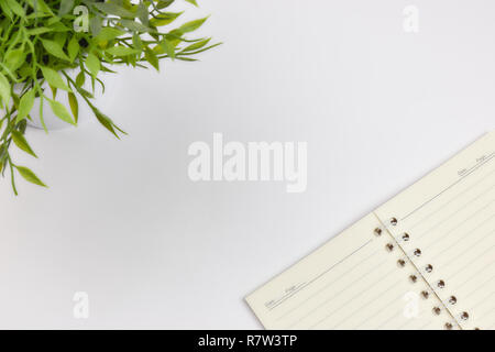 concept of recording your daily affairs. Notepad on a white background. Copy space layout Stock Photo