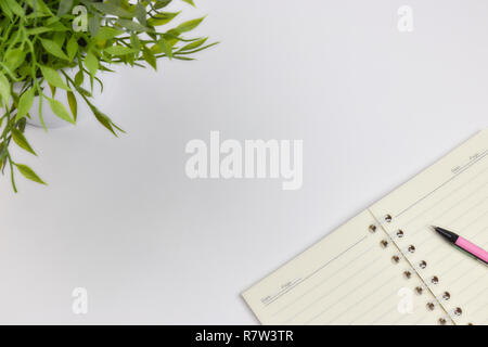 concept of recording your daily affairs. Notepad on a white background. Copy space layout Stock Photo