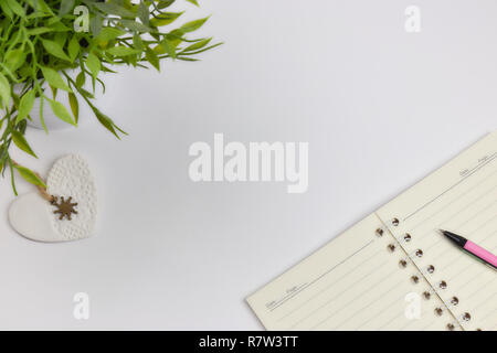 concept of recording your daily affairs. Notepad on a white background. Copy space layout Stock Photo