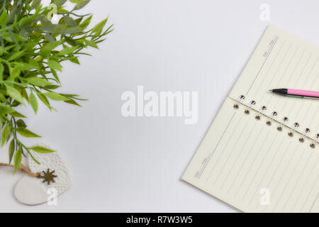 concept of recording your daily affairs. Notepad on a white background. Copy space layout Stock Photo