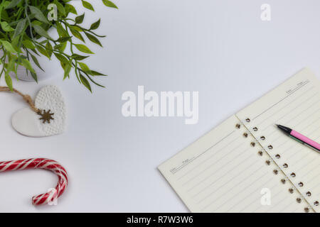 concept of recording your daily affairs. Notepad on a white background. Copy space layout Stock Photo